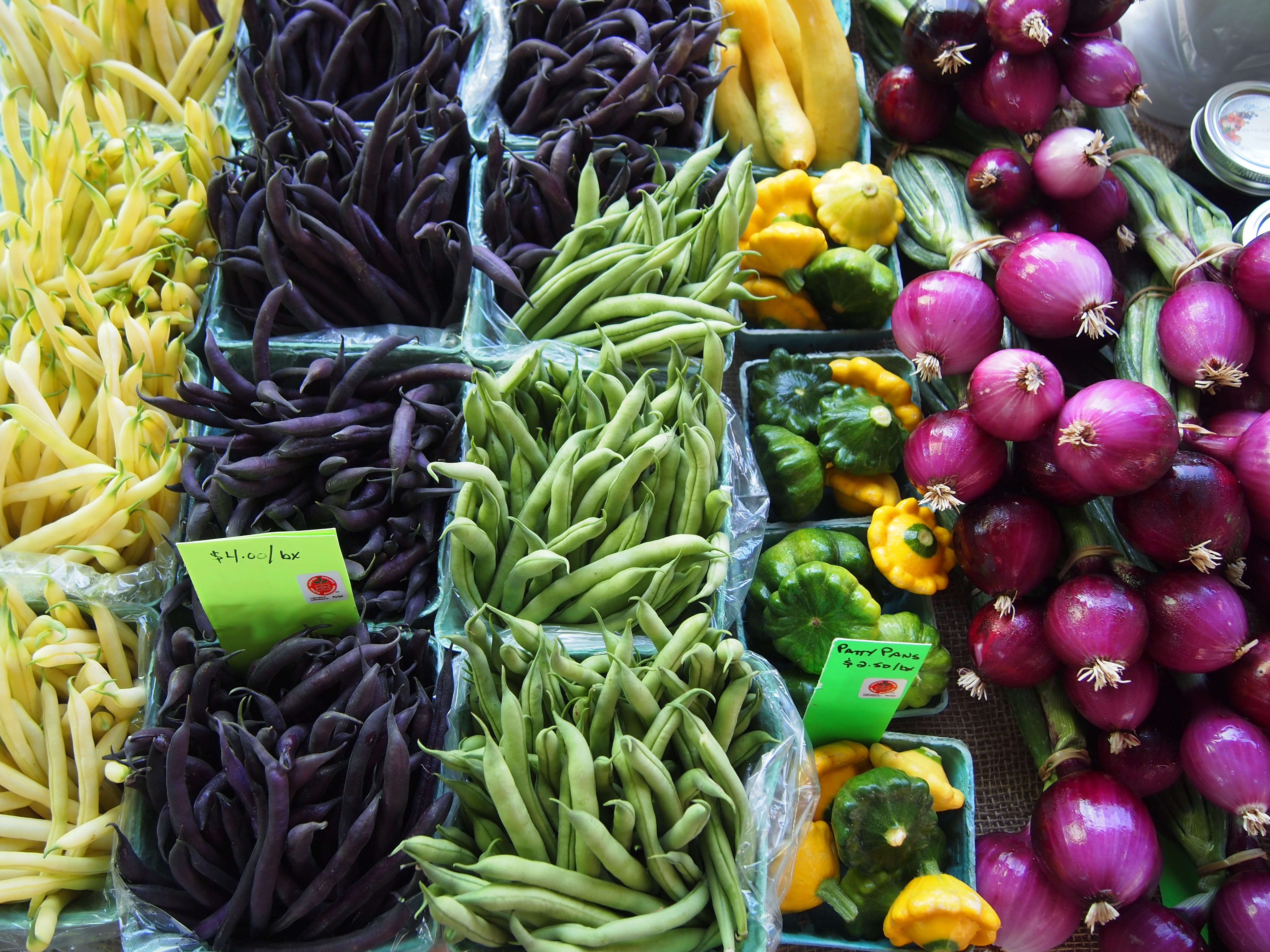 Organic yellow, purple and green beans at the farmer's market