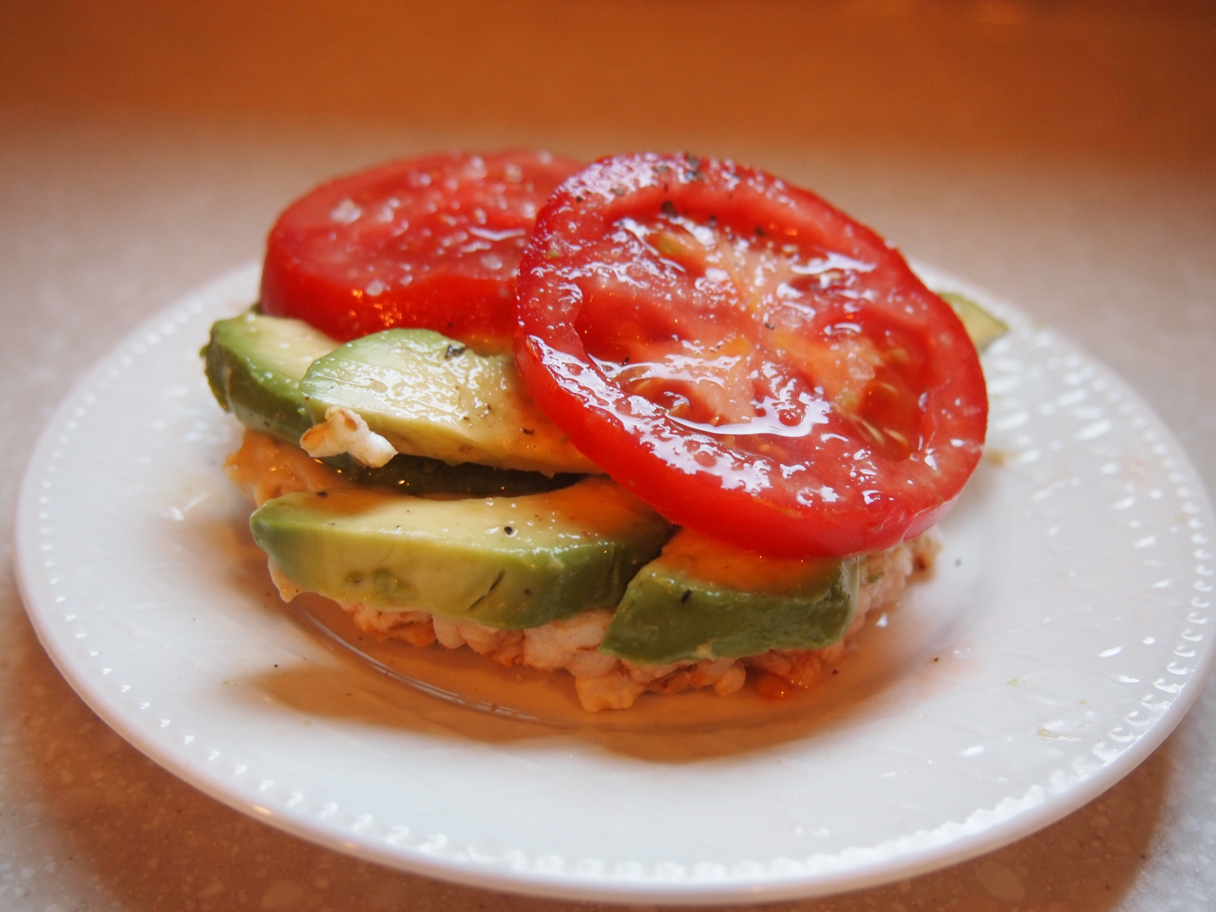 Avocado, Hummus and Tomato on a Brown Rice Cake - Copyright Jo-Ann Blondin